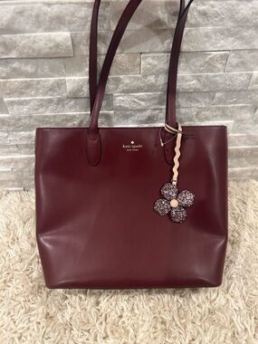 kate spade Burgundy Leather Tote with Floral Charm